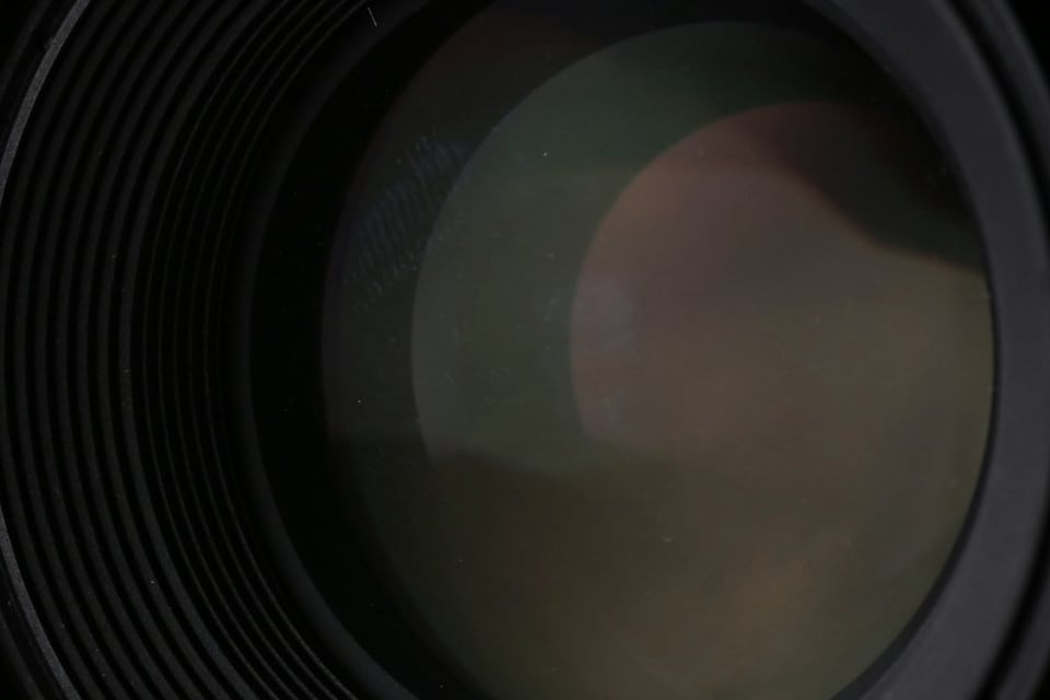 Close-up of the glass and concentric rings of a camera lens