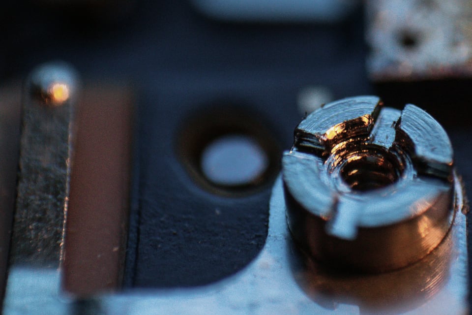 Close-up of a circuit board fastener and components